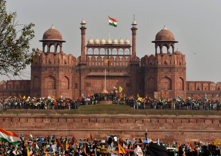 Anti-farm laws tractor rally turns violent, protesters wave flags from ramparts of Red Fort in New Delhi