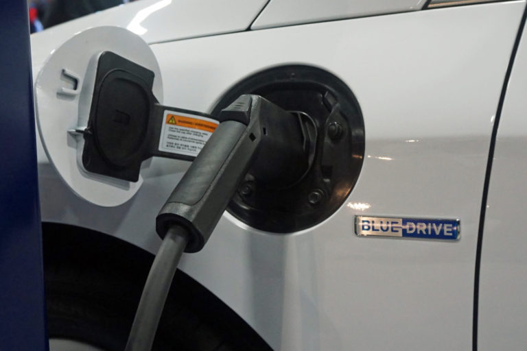 Dr Akhil Gupta compelled to sell electric car as Sydney apartment block denies use of a power point