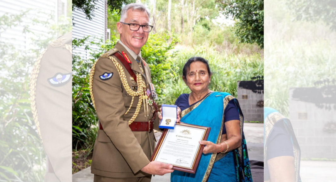 Chief of Army Lieutenant General Rick Burr, with 1st Division's Dr Madhu Patel, celebrating her 50 years of service in the Australian Army at Gallipoli Barracks in Brisbane, Queensland. Photo: Corporal Miguel Anonuevo (Twitter)