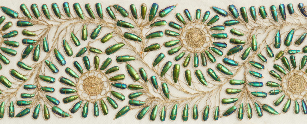 Textile length decorated with beetle wings India. Powerhouse collection acquired 1883. Photo by Zan Wimberley 2 2