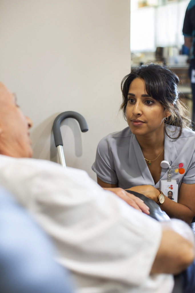Nurse attending to a client - Image credit Bolton Clarke Research Institute