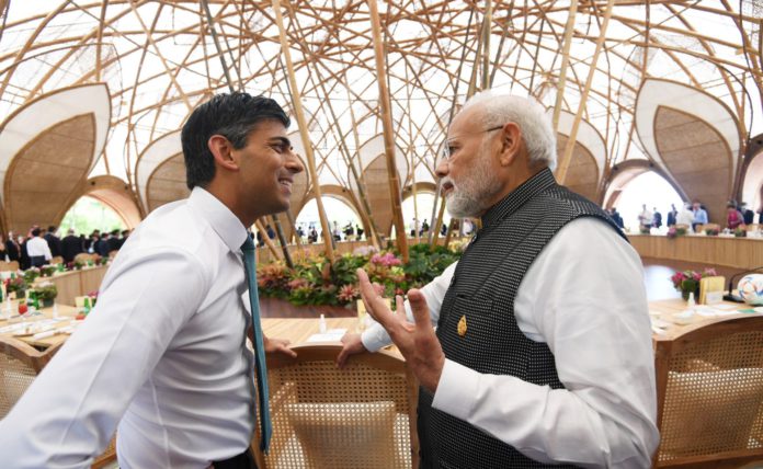 Indian PM Narendra Modi and British Pm Rishi Sunak at G20 meeting; Image Source: @PIB Indian PM Narendra Modi and British Pm Rishi Sunak at G20 meeting; Image Source: @PIB