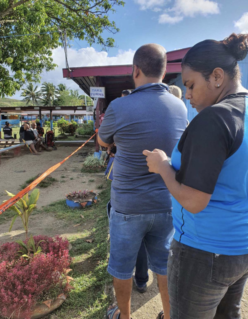 Registered voters at the Sigatoka Andhra Sangam College polling venue showed up early to cast their vote. Picture: ROSELYN BALI