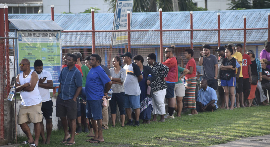 Voters line up outside John Wesley Primary School along Grantham Road in Raiwaqa before 7.30am to cast their vote as polling officially opened today for Fiji’s 2022 General Election. Picture: GERALDINE PANAPASA