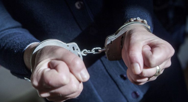 Two women charged over alleged armed robbery at service station 