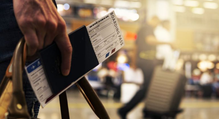 Two men charged with flying under false names