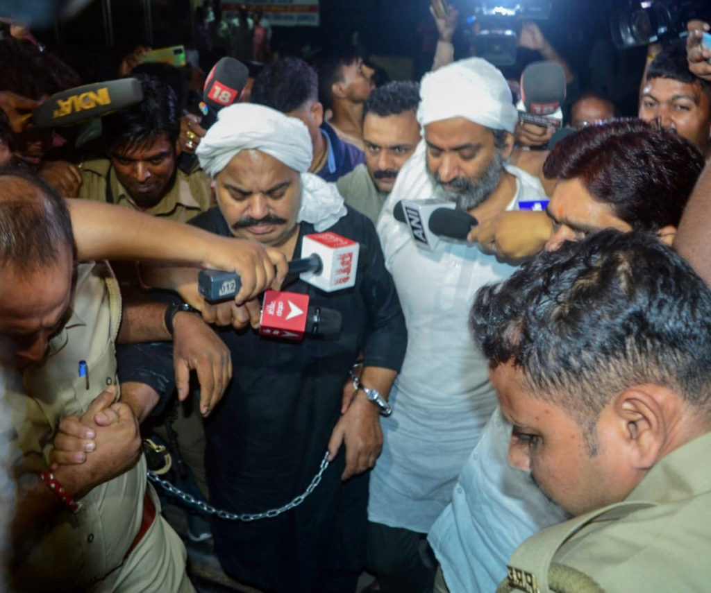 42-year terror reign ends as dreaded gangster duo Atiq Ahmed, brother Ashraf shot dead in India 3 Police escort Gangster Atiq Ahmed and his brother Khalid Azim alias Ashraf to Motilal Nehru Divisional Hospital for health checkup, in Prayagraj on Friday. (ANI Photo)