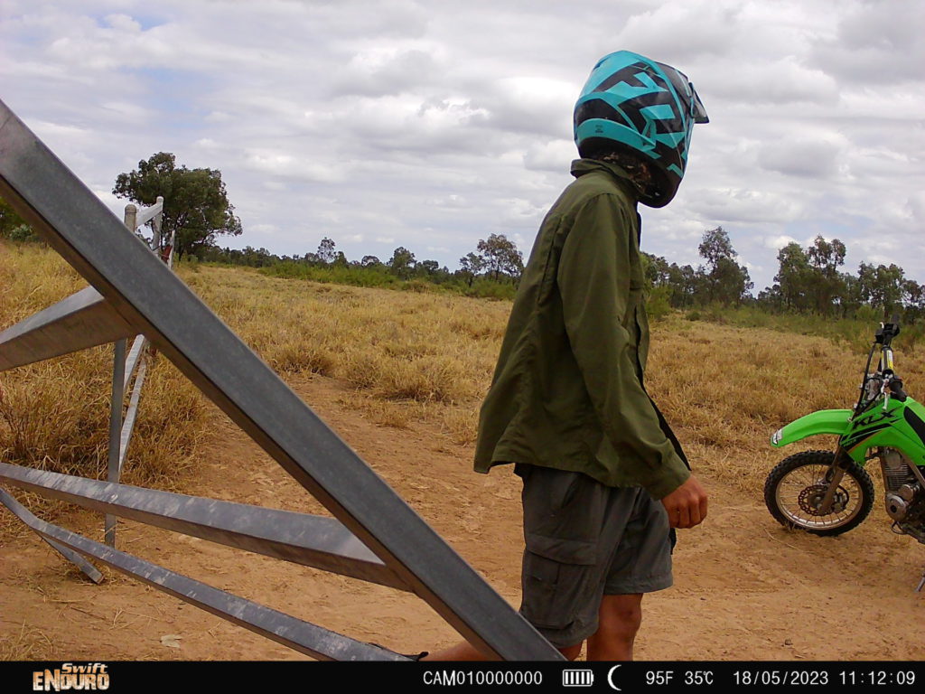 The activist allegedly damaging the stock gates; Image Source: Supplied