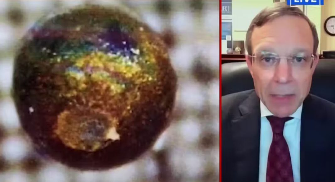 Image: Loeb next to image of spherule. NewsNation/Youtube, CC BY-SA
