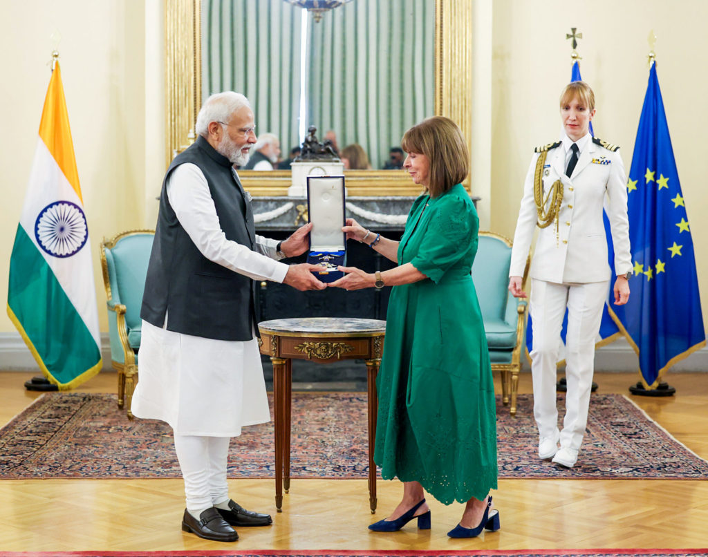 Indian Prime Minister Narendra Modi being conferred with the Grand Cross of the Order of Honour by Greek President Katerina N. Sakellaropoulou, in Athens