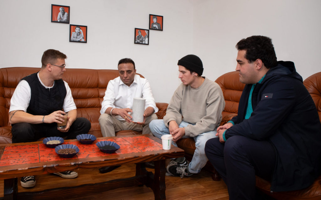 Indian Australian researcher-led team makes stronger concrete from Coffee Waste 2 Drew Paten, Co-founder of Talwali, listens to Dr Rajeev Roychand explain how they used spent coffee grounds in their concrete, with fellow RMIT researchers Dr Shannon Kilmartin-Lynch and Dr Mohammad Saberian (pictured left to right). Credit: Carelle Mulawa-Richards, RMIT University