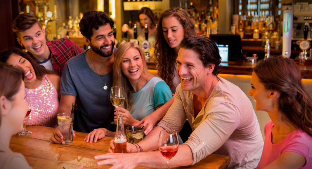 A Group of people at bar; Image Source @Canva