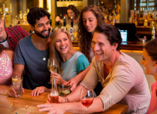 A Group of people at bar; Image Source @Canva