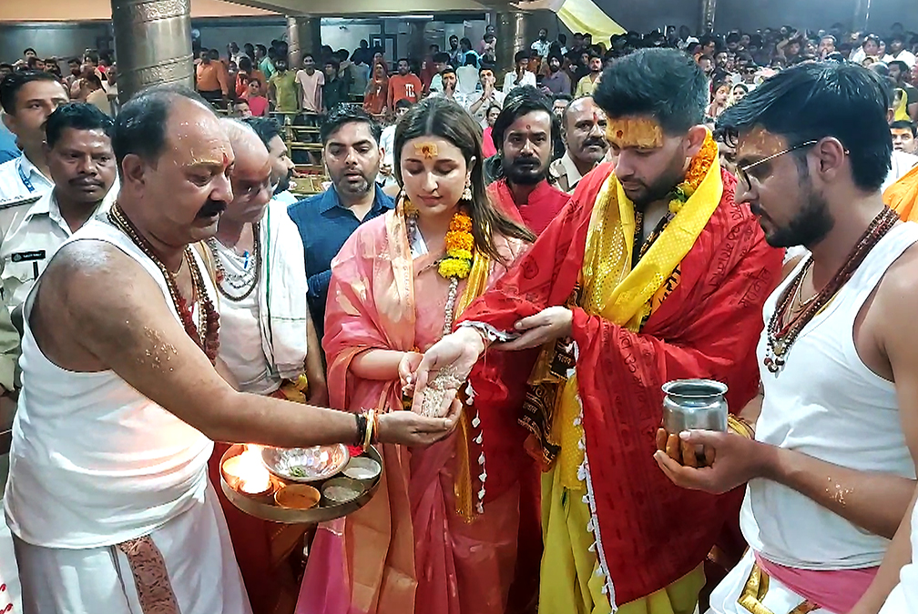 Parineeti-Raghav Wedding: Check out couple's first pic as husband and wife 5 AAP MP Raghav Chadha and his fiancee, actor Parineeti Chopra offer prayers at Mahakal temple in Ujjain on Saturday. (ANI Photo)