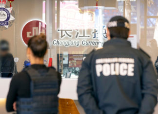 Seven members charged in Australia’s largest ever Money-Laundering Operation AFP search at Changing Currency Exchange; Image Source; AFP supplied