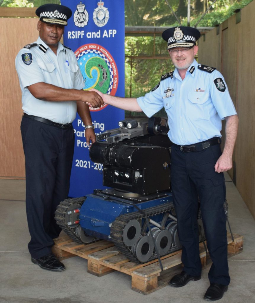 Australia gifts bomb disposal vehicle to Solomon Islands 1 RSIPF Commissioner Mangau and AFP AC Ryan 1 1