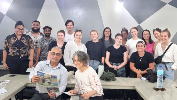 Image: USP's associate professor Shailendra Singh and QUT's professor Angela Romano with Fiji and Australian student journalists in the Wansolwara newsroom at The University of the South Pacific (Source: Wansolwara News)