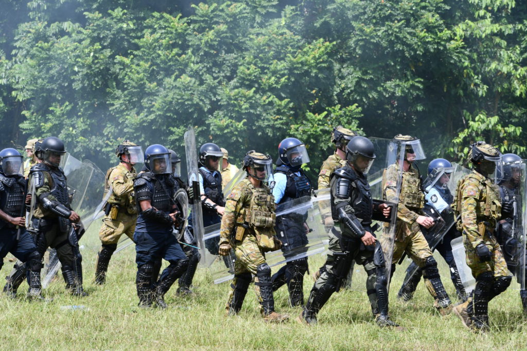 Public Order Management exercise attendees advance during an exercise ahead of NGE24 3