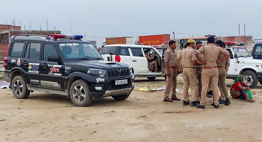Hathras, July 02 (ANI): Police personnel at the spot after around 50-60 people killed in a tragic incident of a stampede at 'Satsang' (religious event) that occurred in Hathras on Tuesday. (ANI Photo)