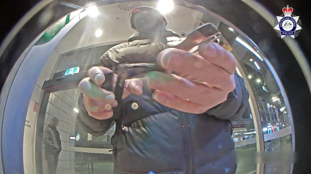 Pair jailed over $36,000 card shimming scam 1 Male with shimmer at Sydney ATM 1 1