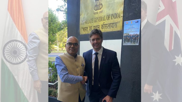 Indian Consul General displays Australian cricket poster after Boxing Day Test bet loss to Melbourne Lord Mayor