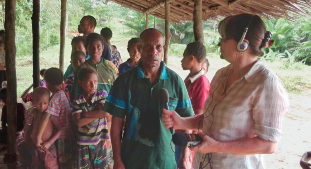 Image: Jemima Garrett conducting an interview in Drimgas village, Western Province, Papua New Guinea (Source: Facebook - Jemima Garrett)