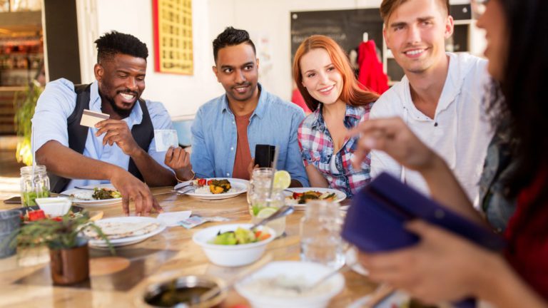 Time to ditch splitting the bill? Shouting a close friend could actually make you happier