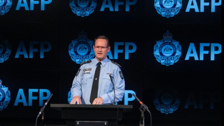 Chinese national charged under foreign interference law for allegedly spying on Canberra Buddhists