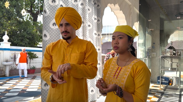 Image: Receiving halwa and relishing its sweetness … a deep connection to community and the world through food (Source: Supplied)