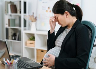 If you’re pregnant, do you have to tell your boss? And what are the rules for employers? Image Source: CANVA