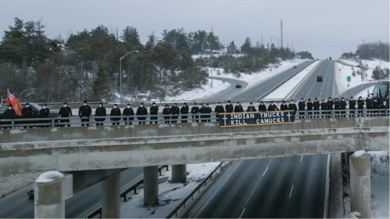 ‘Indian trucks kill Canucks’ banner sparks outrage at Canadian overpass protest against migrant drivers