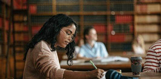 International Student: Image Source: CANVA