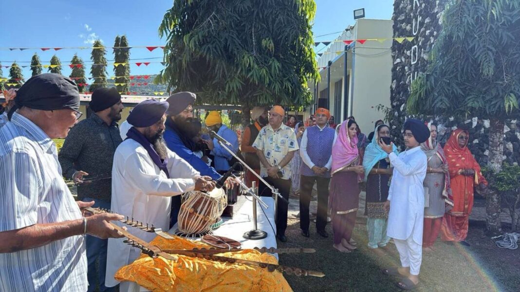 Image: Indian High Commissioner to Fiji Suneet Meht and Fiji's Minister for Public Enterprises, Multi-Ethnic Affairs, Culture, Heritage and Arts Charan Jeath Singh with local community members (Source: X)