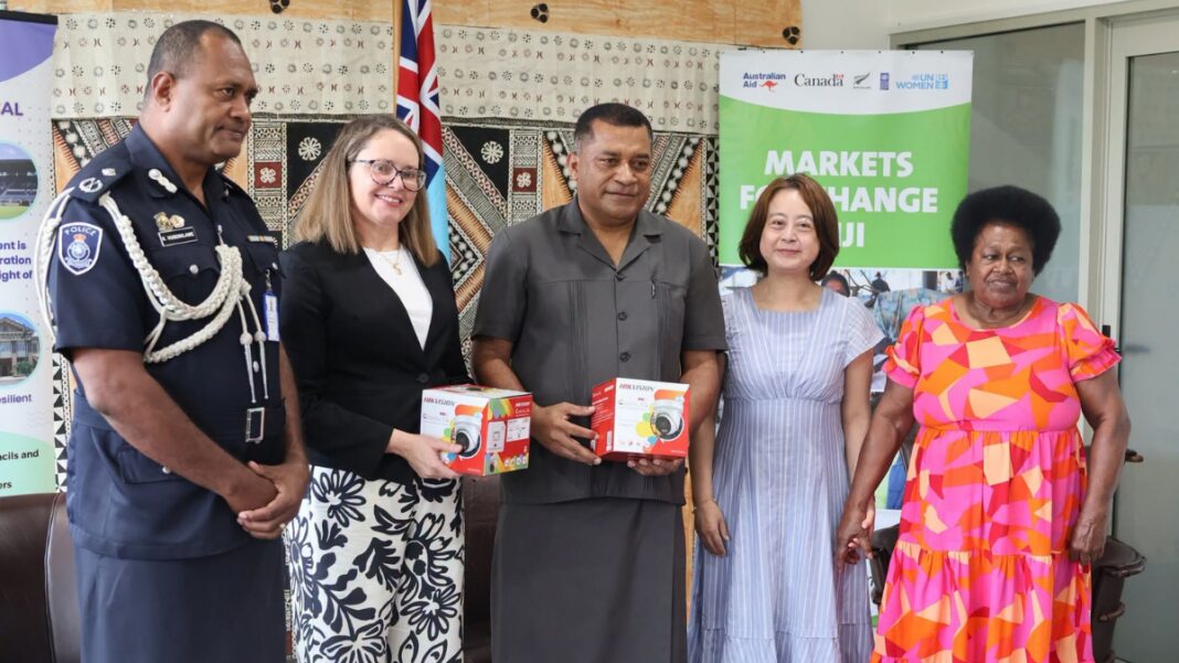 Image: Fiji’s Minister for Housing and Local Government, Maciu Katamotu Nalumisa, officially received the equipment on behalf of the Fiji Government at a handover ceremony in Suva. He was joined by Australia’s Deputy High Commissioner to Fiji, Elizabeth Petrovic, and UN Women Deputy Representative Eri Taniguchi (Source: Facebook)